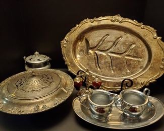 Silverplated assortment. Large platter 20", covered dish 12x4", strawberry salt and pepper set, creamer and sugar bowls, tray 12", tin container 5". https://ctbids.com/#!/description/share/768256