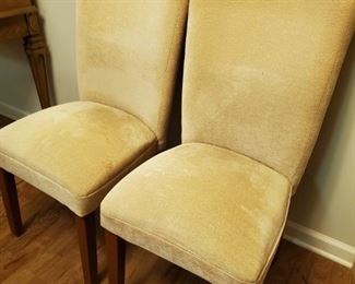 Pair of matching yellow fabric dining chairs with wooden legs. 18x19x39" seat height 18" Pet free and smoke free home.

https://ctbids.com/#!/description/share/768265