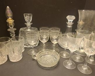 20 pieces of dishes. Six glasses with an ivy design, four wine glasses, four glasses, a small candy dish, two decanters, a candle holder and two candle holders with pretty bulbs set in them.

https://ctbids.com/#!/description/share/768304