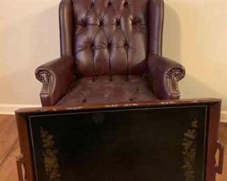 This Queen Anne chair comes with wooden serving tray and features oxblood fabric and has brass stud accents. The serving tray has a painted floral design. Chair: 28x34x38 Tray: 32x20

https://ctbids.com/#!/description/share/768316