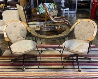3-Piece Set; Removable Glass Top Table with Black Metal Frame and 2 Vintage Upholstered Chairs with Wooden Back Frame and on rolling casters 