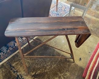 Antique wooden ironing board, turned into a table