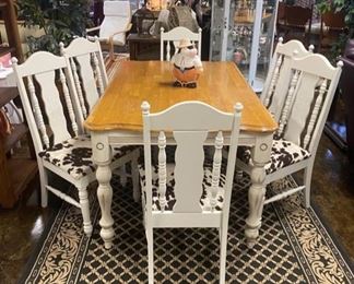 7-Piece Dining Room Suite, Reupholstered Seats in an adorable Cowhide-Print-Fabric, chairs are vintage with  carved detailing