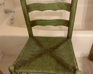Nice green chair with rush seat.