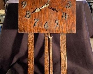 Mission oak wall clock with metal numbers and brass pendulum. Does chime but needs something fixed . No key - $75