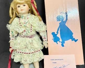 1989 Marian Yu Design Co Porcelain Victorian Doll. Has original box and certificates. Barefoot with stand. Measures 16" tall. No chips or cracks, marked No 619/10,000. $25