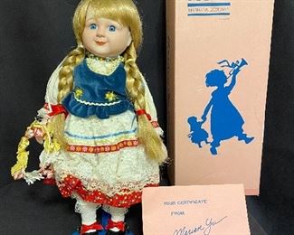 Porcelain doll by "Marian Yu Design Co" 1989 limited edition, has box and certificates. "Gerta" measures 16" tall and in mint condition with stand. Marked with number  426/5000. $25