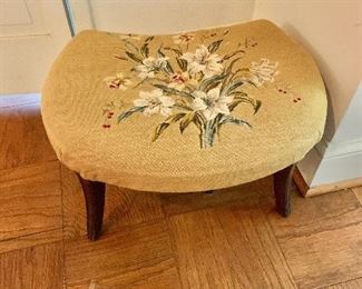 $75 - Needlepoint footstool; AS IS, bottom liner is ripped, wear to the legs. 21" W x 16" D x 12" H