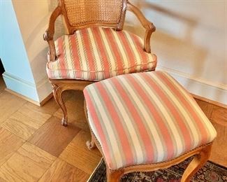 $350 - Louis XV style caned chair with cushion and matching ottoman; 33" H x 23" W x 22" D, seat height is approx 15" (ottoman is 18" x 18" x 18")
