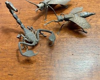 $75 - Group of 3 vintage metal insects. One wasp has a pin affixed to the back and is approximately 3" long and 1.5" wide.