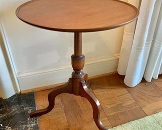 $150 - Round tilt-top table made by Copenhaver's Furniture in Winchester, Va.; as is, one very small crack in one foot. 23" H x 19" diameter, stands 34" H when stored vertically.