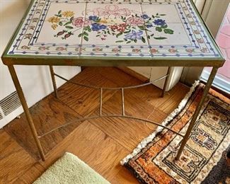 $100 - Small side table with metal frame and handpainted tile top; 18" W x 12" D x 17" H