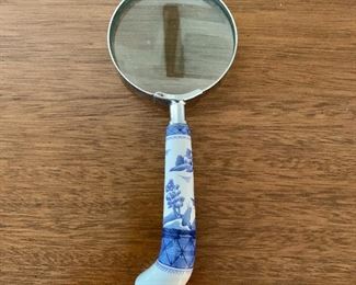 $20 - Magnifying glass with blue and white handle; 7.5" long
