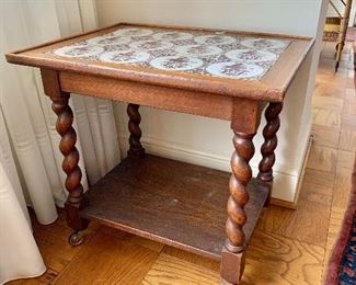 $175 - Turned leg side table with tile top; AS IS, slight wobble due to one short leg. 24" H x 19" D x 25" W