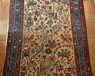 $450 - Sarouk scatter rug; foliate and bird motif on beige field, 33" x 45" - wear consistent with age and use