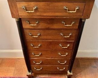 $550 - Italian walnut 7-drawer Empire commode; 40.5" H x 22" W x 13.5" D