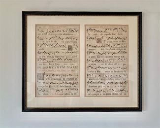 $150 -Two framed antique musical scores on parchment; 25" H x 30" W