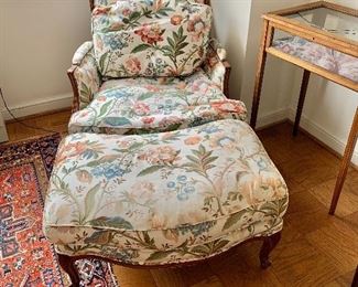 $450 - Louis XV style Bergere chair and matching footstool; feather filled cushion; AS IS, fabric torn on ottoman. Chair 35" H x 32" W x 39" D, seat height is approx 14". Together the chair and ottoman are 62" deep