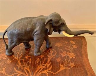$300 - Bronze table sculpture elephant; 7.5" H x 16" W x 5.5" D