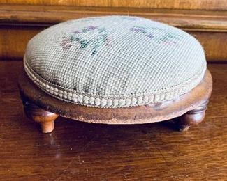 $30 - Needlepoint pincushion/ small footstool; 9" W x 4.5" H