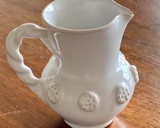 $30 - Miniature ceramic glazed creamer; as is, tiny chip in the spout. 3" H