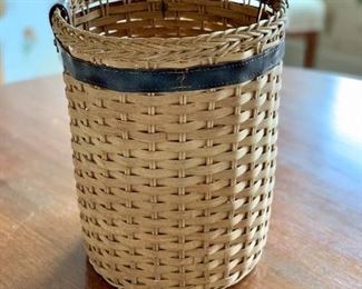 $24 - Hand woven waste basket with leather trim; 11" H x 8" W
