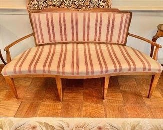 $1,200 - Antique French continental fruitwood framed settee with burgundy striped upholstery, minor stains to the fabric on the seat; 61" W x 33.5" H x 25" D