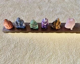 $250 - Total of six Chinese carved semiprecious stone immortals on a stand. Stand is 16.5" wide. Tallest figure is 2.75" H.