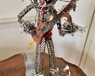 $250 - Dragutin Fradl signed folk art mixed metal guitar player; 18" H x 12" D x 9" W