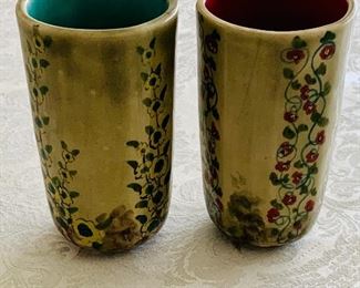 $40 - Set of 2 Ceramic hand painted tumblers; signed; 5” (H) x 2.5” (W)