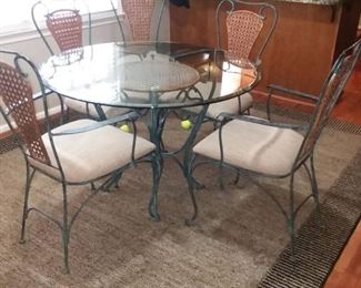 Glass Top Wrought Iron and Cane Table and 5 Chairs