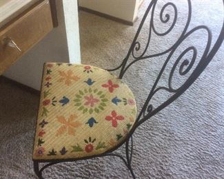 Pair of iron chairs with embroidered seats