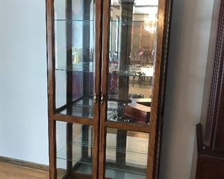 Pulaski Furniture Company lighted curio display cabinet.