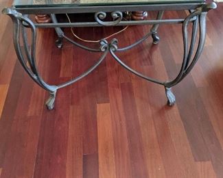 Glass top side table on cast iron legs