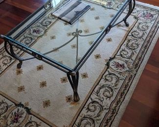 Glass top coffee table on cast iron legs