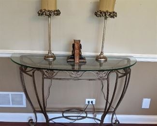 Glass and cast iron demilune table.  