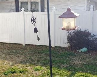 Double Shepherd's hooks with bird feeders and wind chimes