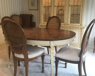 Oval dining room table with six chairs and two leaves