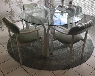 Glass top round table with four chairs