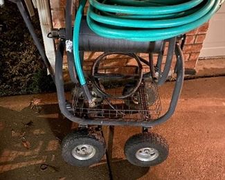 Large heavy duty rolling hose cart with like new hose $75 firm