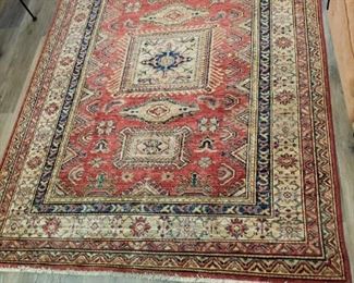 Several area rugs of different sizes