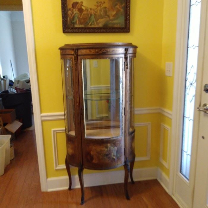 Antique French Cabinet with Bow front glass and wood, hand painted on wood with gold guild trim.. key works to lock
4ft. 7-1/2 in. Tall
1ft. 1-1/2 in. Depth
2ft. 5in. Wide
$350.00