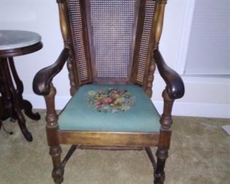 $175.00  Large cane back chair needlepoint seat. Seat is 21in wide, 20in depth... Chair is 44in tall x 26in wide x 21 in depth