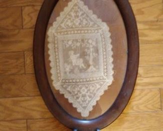 Wood tray with doily inside gllass top