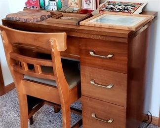 New Home sewing machine in cabinet with chair