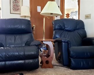 Two blue leather recliners