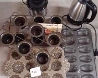 LOT 14; $20.00 Bake-Ware collection includes : popovers, muffins, mini crock pot, small coffee warmer pot, cookbook.