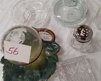 LOT 56 NEW PRICE 10.00 glass cloche on leaf plate w misc, crystal covered candy dish, serving items