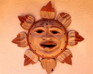 Several terracotta outdoor wall decor pieces (Sun)