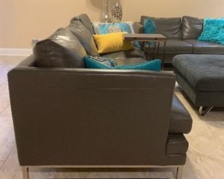 Dark gray leather couch w/chrome legs and matching love seat